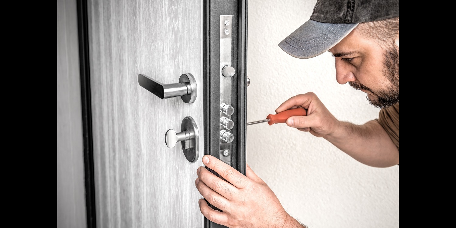 Locksmith fixing a door