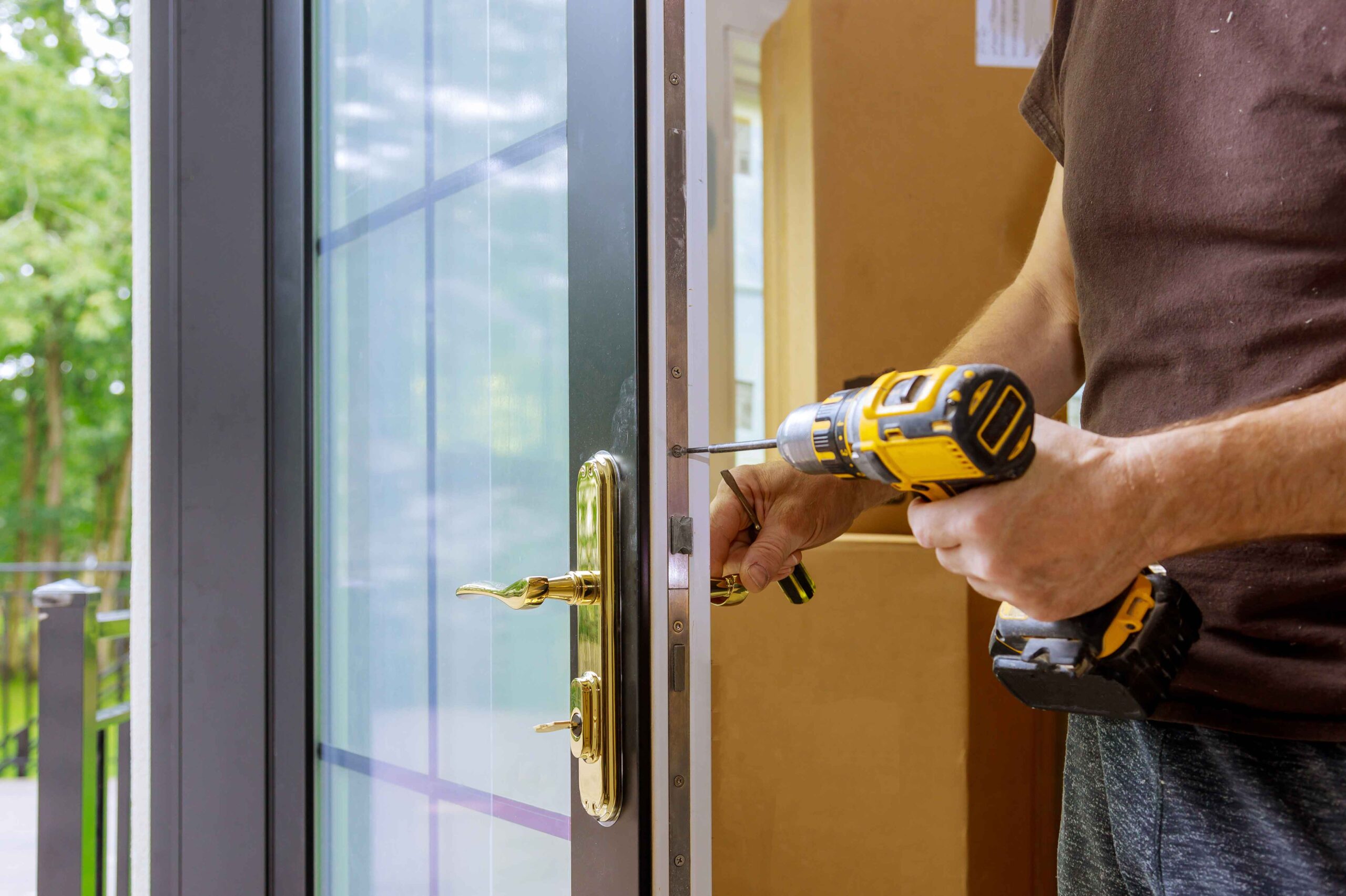 a locksmith testing a door after replacing the lock